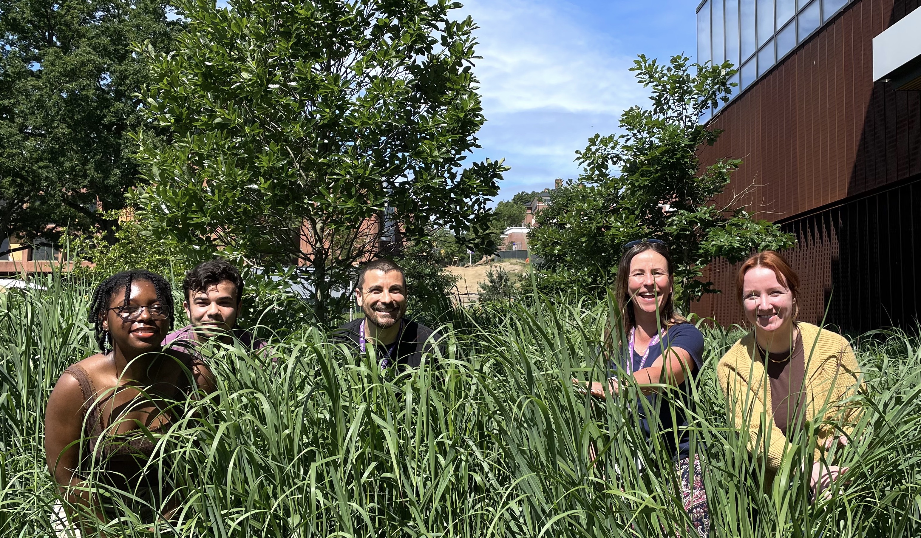 Trapani Lab members gathered on the grass in 2023